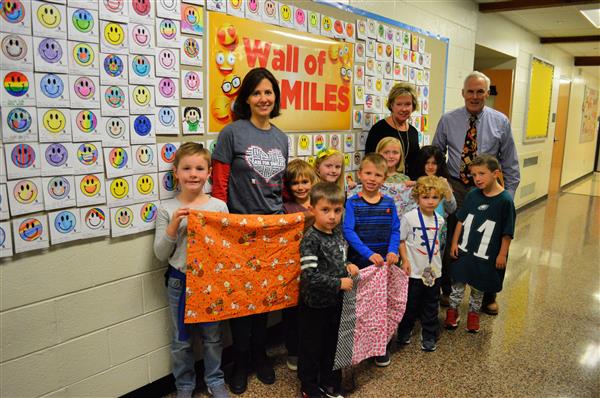 Liz Koshgerian, Penn Wood students, Dr. Ellen Gacomis, principal, and Jeff Pearsall, school counselor, dis 